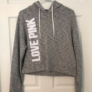 Pink cropped sweatshirt.